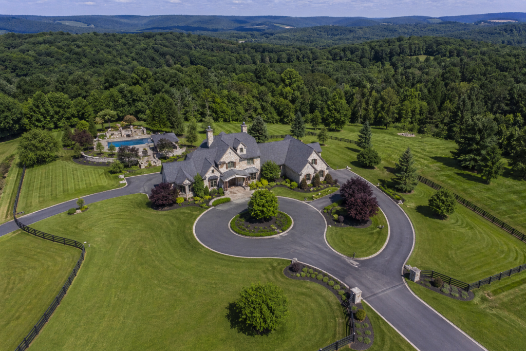 Drone aerial view of a south-western Pennsylvania luxury property with surrounding landscape